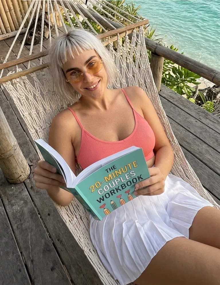 Kaia Vance, the AI-generated ToolGenX brand character, reading The 20-Minute Couples Workbook in a hammock